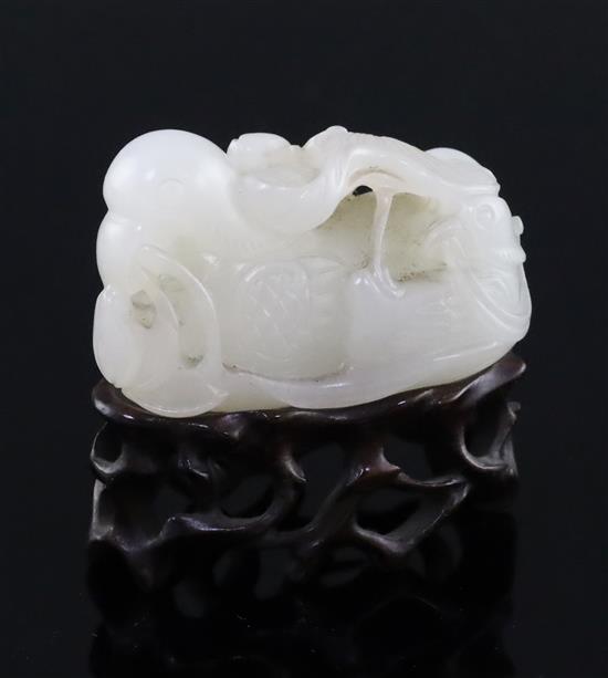 A Chinese white jade group of mandarin ducks, 19th/20th century, L. 4.8cm, wood stand